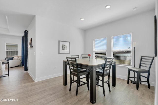 dining space with light wood-type flooring