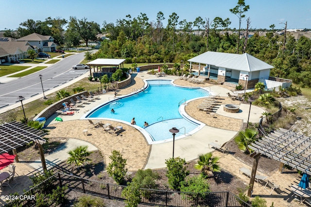 view of swimming pool featuring a patio area