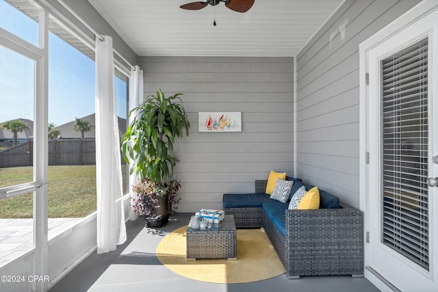 sunroom / solarium with ceiling fan