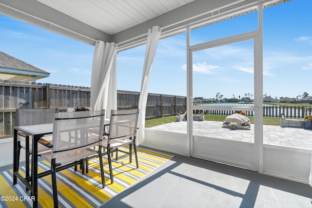 sunroom with a water view