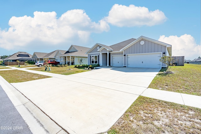 single story home featuring a front lawn and a garage