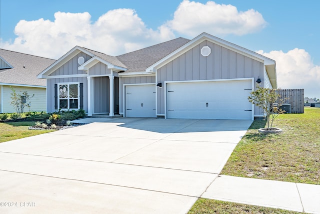 view of front of house featuring a garage and a front yard