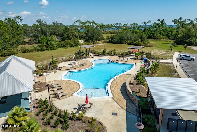 view of swimming pool with a patio area