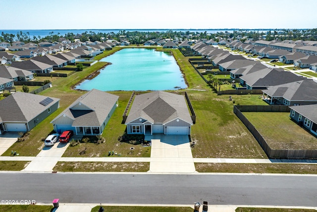 drone / aerial view with a water view