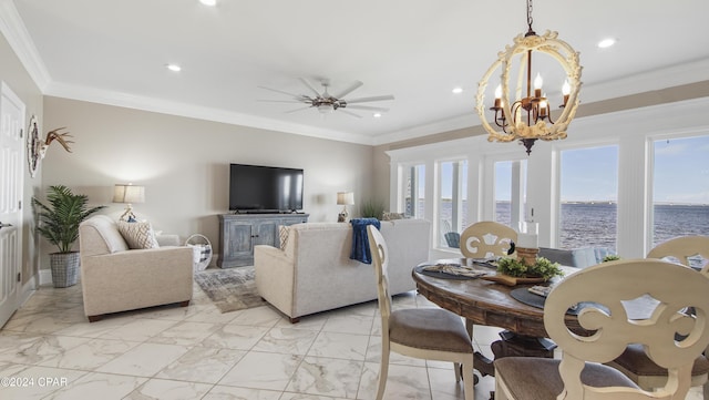 living room featuring ceiling fan with notable chandelier and crown molding