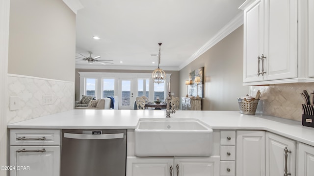 kitchen featuring dishwasher, white cabinets, ornamental molding, and sink