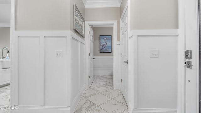 hall featuring crown molding and tile walls