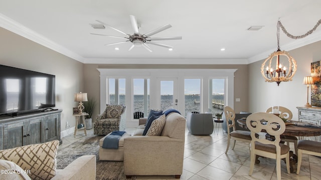 living room featuring french doors, a water view, plenty of natural light, and ornamental molding