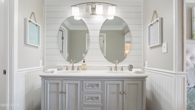 bathroom featuring vanity and ornamental molding