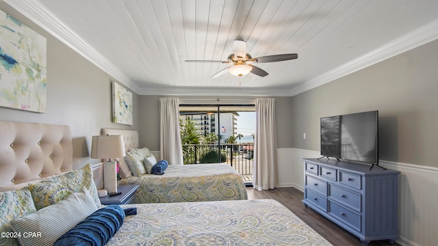 bedroom featuring ornamental molding, ceiling fan, access to exterior, and dark hardwood / wood-style flooring