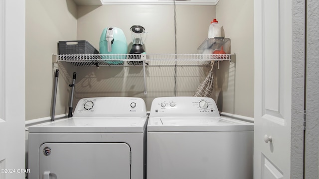 laundry area with washing machine and clothes dryer