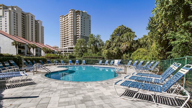 view of pool featuring a patio