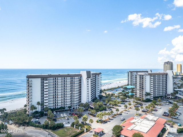 birds eye view of property featuring a view of the beach and a water view