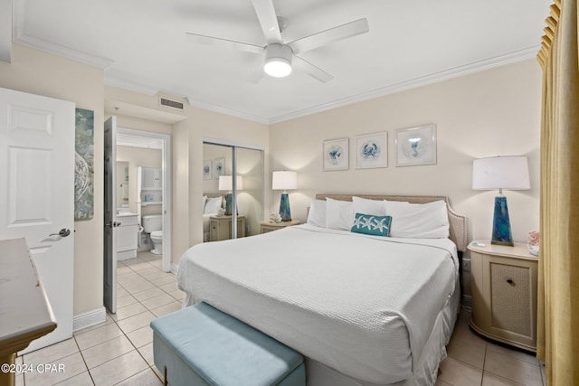 bedroom featuring ceiling fan, a closet, light tile patterned flooring, and ornamental molding