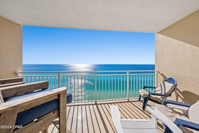 balcony featuring a water view