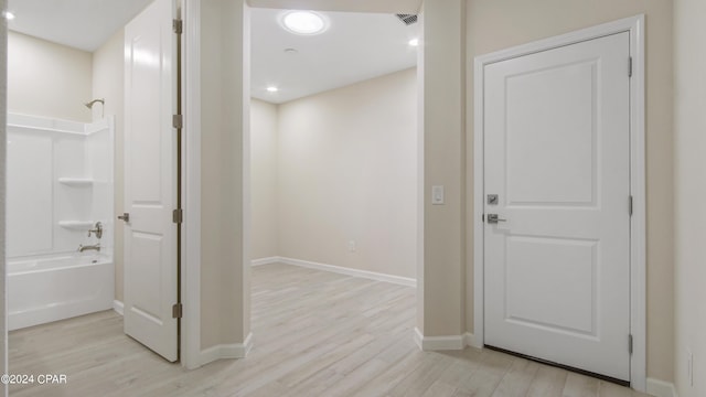 hallway with light wood-type flooring