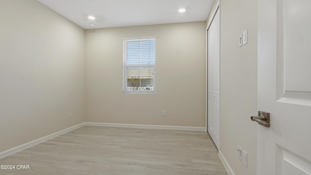 spare room featuring light hardwood / wood-style flooring