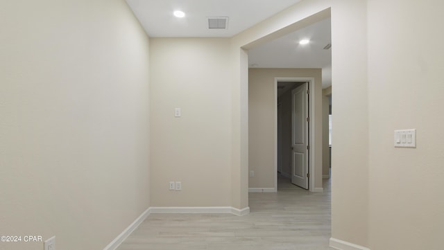 hall with light wood-type flooring