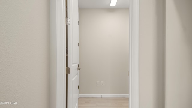 hall with light hardwood / wood-style floors