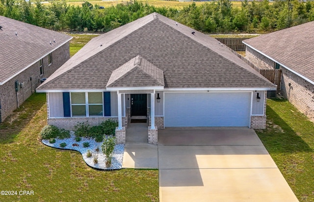 view of front of house with a front lawn and a garage