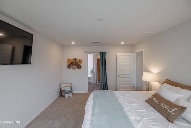 bedroom with light carpet