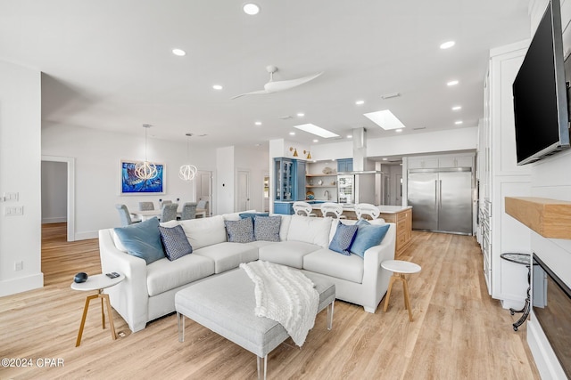 443 Wahoo Rd, Panama City Beach, FL 32408 - living room with a skylight, light wood-style floors, recessed lighting, and baseboards