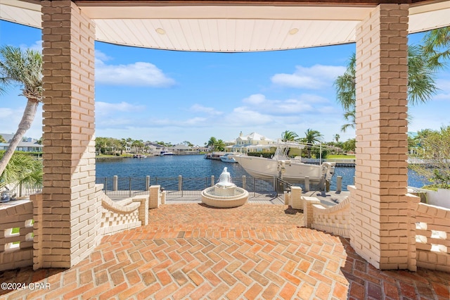 view of patio with a water view