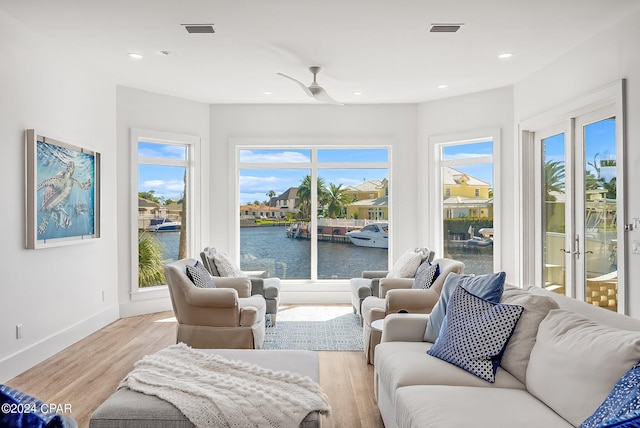 443 Wahoo Rd, Panama City Beach, FL 32408 - living room featuring a water view, light wood finished floors, plenty of natural light, baseboards, and recessed lighting