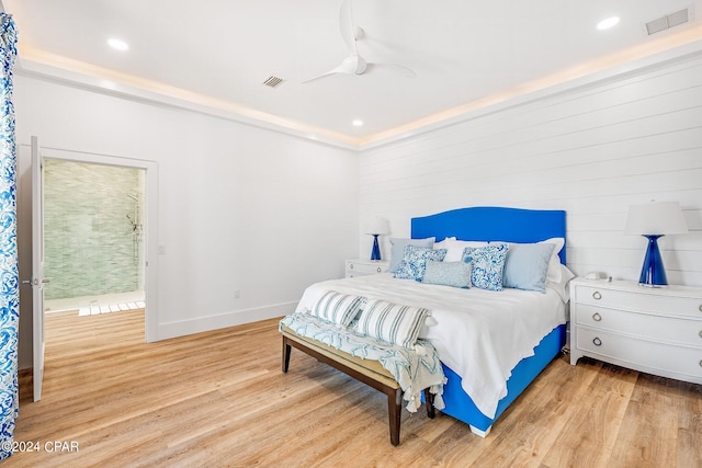 bedroom with ornamental molding, light hardwood / wood-style floors, and ceiling fan