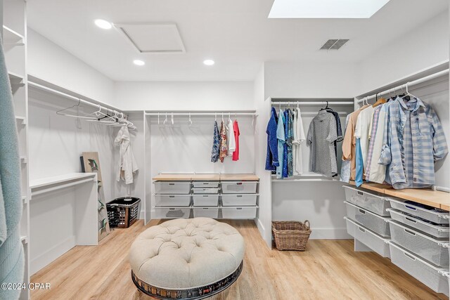 443 Wahoo Rd, Panama City Beach, FL 32408 - spacious closet featuring wood finished floors and attic access