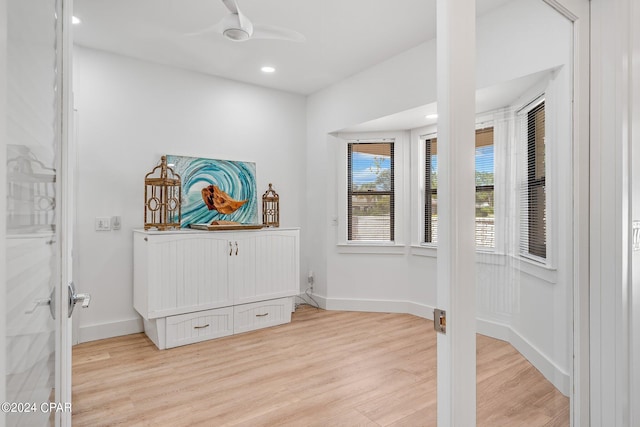 unfurnished bedroom featuring ceiling fan and light wood-type flooring