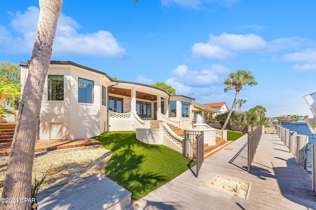 view of front of property with a water view