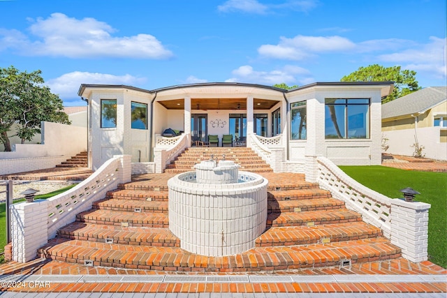 443 Wahoo Rd, Panama City Beach, FL 32408 - contemporary home with stairs, ceiling fan, and brick siding