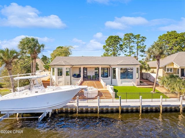 rear view of house with a water view