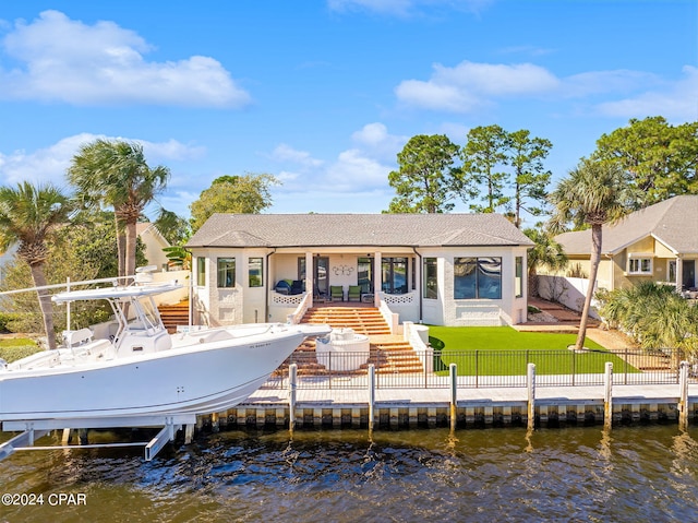 443 Wahoo Rd, Panama City Beach, FL 32408 - back of property with boat lift, a water view, stairway, and stucco siding