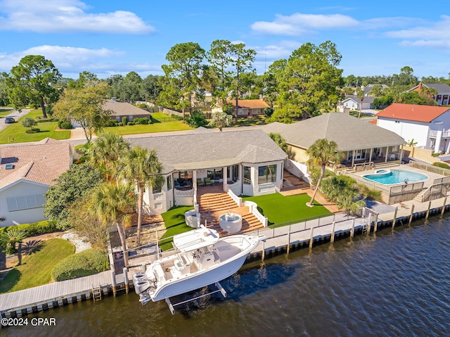 birds eye view of property featuring a water view