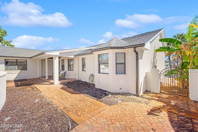 rear view of property with a patio area