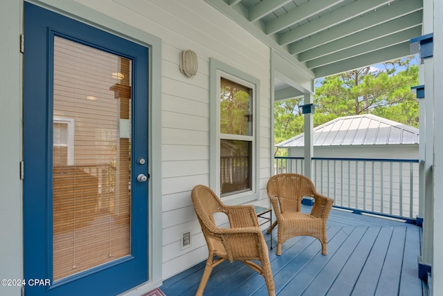 wooden terrace with a porch