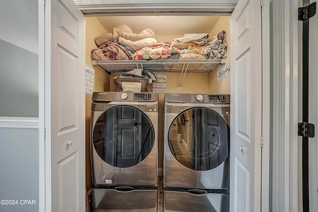 clothes washing area with washing machine and clothes dryer