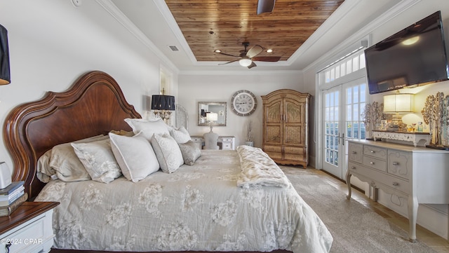 bedroom featuring visible vents, a raised ceiling, wood ceiling, and crown molding