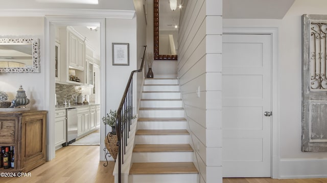 staircase featuring wood finished floors