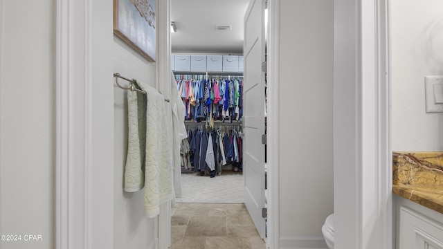 walk in closet with visible vents