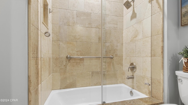 bathroom with toilet and washtub / shower combination