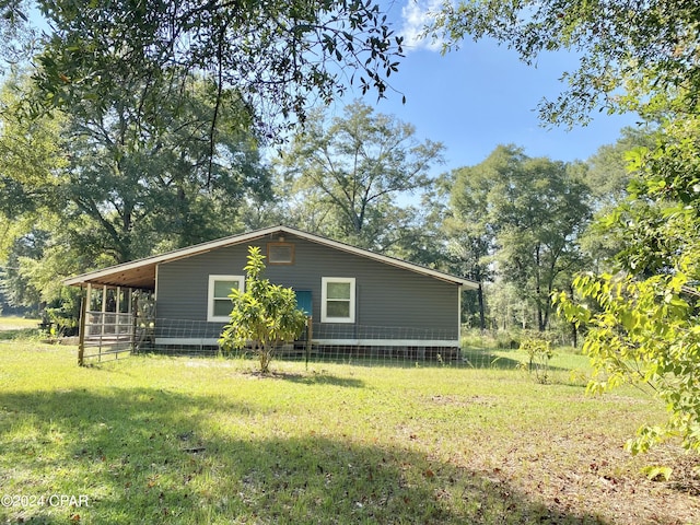 view of property exterior with a yard