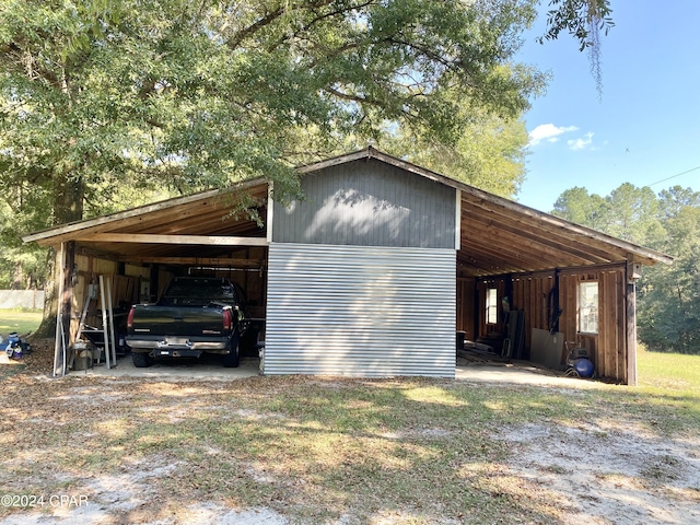 view of property exterior with an outdoor structure