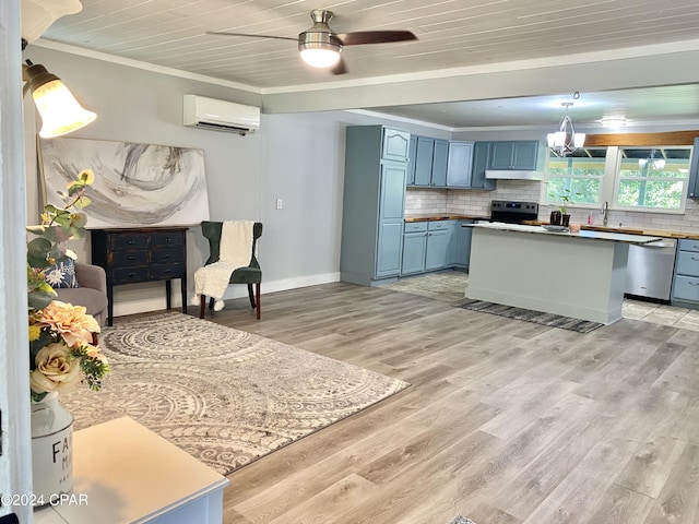 kitchen with ceiling fan, stainless steel appliances, light wood-type flooring, and an AC wall unit