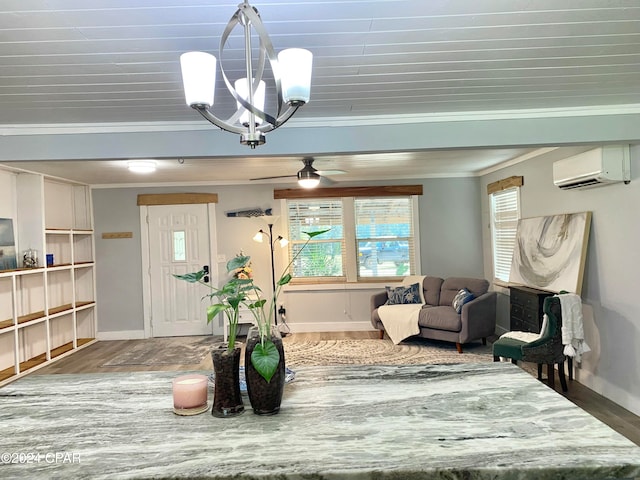 interior space featuring crown molding, a wall mounted AC, wood-type flooring, and ceiling fan with notable chandelier