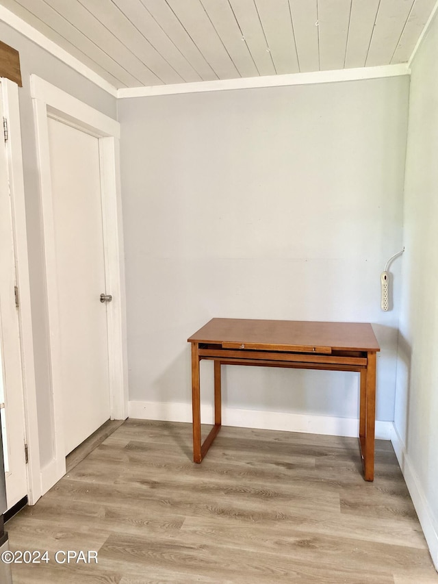 miscellaneous room featuring crown molding, light hardwood / wood-style flooring, and wood ceiling