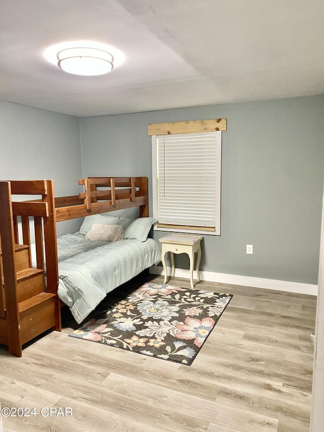 bedroom with wood-type flooring