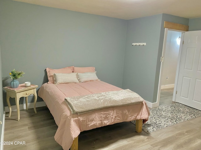 bedroom featuring hardwood / wood-style flooring